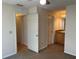 Main bedroom with carpet and access to bathroom at 6088 Westgate Dr # 203, Orlando, FL 32835