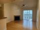 Bright living room with hardwood floors, fireplace, and sliding doors at 6088 Westgate Dr # 203, Orlando, FL 32835