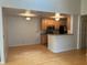 Open kitchen with wood cabinets and a breakfast bar at 6088 Westgate Dr # 203, Orlando, FL 32835