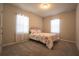 Cozy bedroom with floral bedding and carpeted floor at 2252 Crossbow St, Minneola, FL 34715