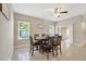 Bright dining room with seating for six, adjacent to the kitchen at 468 Acacia Tree Way, Kissimmee, FL 34758