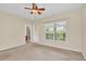 Spacious bedroom with neutral carpeting and access to balcony at 655 Pensacola Ln, Lake Mary, FL 32746