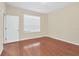Bedroom with hardwood floors and a window with blinds at 655 Pensacola Ln, Lake Mary, FL 32746