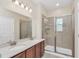 Double vanity bathroom with a large walk in shower at 655 Pensacola Ln, Lake Mary, FL 32746