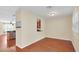 Dining room with hardwood floors and view into kitchen at 655 Pensacola Ln, Lake Mary, FL 32746