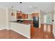 Modern kitchen with wood cabinets, granite counters and black appliances at 655 Pensacola Ln, Lake Mary, FL 32746