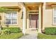 Inviting entrance to a light yellow townhouse at 655 Pensacola Ln, Lake Mary, FL 32746