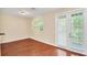 Bright dining room with hardwood floors and access to balcony at 655 Pensacola Ln, Lake Mary, FL 32746