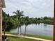 Scenic view of a tranquil lake with lush greenery at 1909 Summer Club Dr # 307, Oviedo, FL 32765
