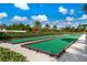 Two bocce ball courts with green playing surfaces and wooden borders at 2026 Key Bay Trl, Kissimmee, FL 34747