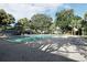 Inviting community pool with plenty of lounge chairs for sunbathing at 301 Lewfield Cir, Winter Park, FL 32792