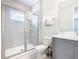 Bathroom featuring shower, toilet and vanity at 7702 Graben St, Kissimmee, FL 34747