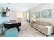 Upstairs game room with air hockey, seating area and large TV at 7702 Graben St, Kissimmee, FL 34747