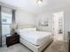 Bright bedroom with king-size bed and access to another room at 7702 Graben St, Kissimmee, FL 34747