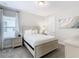 Cozy bedroom with a queen-size bed and window at 7702 Graben St, Kissimmee, FL 34747
