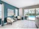 Relaxing living area with pool view and access to outdoor space at 7702 Graben St, Kissimmee, FL 34747