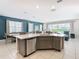 Large kitchen island with sink, dishwasher and plenty of counter space at 7702 Graben St, Kissimmee, FL 34747