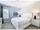 Spacious bedroom with king-size bed and neutral decor at 7702 Graben St, Kissimmee, FL 34747