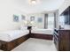Bedroom with twin beds and built in storage at 7702 Graben St, Kissimmee, FL 34747