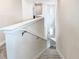 View of staircase leading to the upper level of the home at 7702 Graben St, Kissimmee, FL 34747