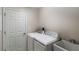 Laundry room with washer, dryer, and utility sink at 4312 Heritage Trl, Leesburg, FL 34748