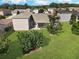 Aerial view showcasing home's backyard and surrounding landscape at 4312 Heritage Trl, Leesburg, FL 34748