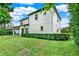 Two-story house with white exterior, manicured lawn, and a covered patio at 808 Sherbourne Cir, Lake Mary, FL 32746