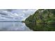 Stunning waterfront view with lush trees at 1150 Carmel Cir # 201, Casselberry, FL 32707
