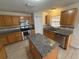 Modern kitchen with stainless steel appliances and granite island at 2756 S Elston Dr, Deltona, FL 32738