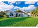 Single story home with a two car garage and large front yard at 7304 High Lake Dr, Orlando, FL 32818