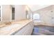 Bathroom with double vanity, granite countertop, and marble shower at 7304 High Lake Dr, Orlando, FL 32818