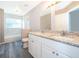 Bathroom with double vanity, granite countertop, and a tub at 7304 High Lake Dr, Orlando, FL 32818
