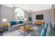 Spacious living room with large windows and modern decor at 7304 High Lake Dr, Orlando, FL 32818
