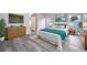 Bright bedroom with wood-look floors, large window, and ample closet space at 7304 High Lake Dr, Orlando, FL 32818