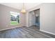 Dining room with gray walls, vinyl plank flooring, and a chandelier at 7304 High Lake Dr, Orlando, FL 32818