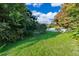 Spacious backyard with lush green grass and trees at 7304 High Lake Dr, Orlando, FL 32818