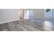 Spacious living room featuring gray vinyl plank flooring and lots of natural light at 7304 High Lake Dr, Orlando, FL 32818