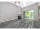 Living room with fireplace, vinyl flooring, and sliding glass doors at 7304 High Lake Dr, Orlando, FL 32818
