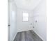 Clean laundry room with gray flooring and shelving at 7304 High Lake Dr, Orlando, FL 32818
