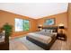 Large main bedroom with plush carpet and large window at 3936 Magnolia Pointe Ln, Orlando, FL 32810