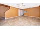 Living room with tile floors and an orange wall at 3936 Magnolia Pointe Ln, Orlando, FL 32810