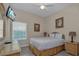 Bedroom with a double bed, nightstands, and a ceiling fan at 514 Lucaya Loop # 514, Davenport, FL 33897