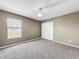 Bedroom with double closet and ceiling fan at 11121 Sunup Ln, Orlando, FL 32825