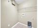 Laundry room with shelving and hookups at 11121 Sunup Ln, Orlando, FL 32825