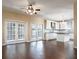 Open concept kitchen and dining area with white cabinets, granite island, and dark hardwood floors at 2148 Chippewa Trl, Maitland, FL 32751