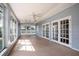 Sunroom with tiled floor and access to the backyard at 2148 Chippewa Trl, Maitland, FL 32751