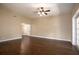 Bright living room with dark hardwood floors and access to the backyard at 2148 Chippewa Trl, Maitland, FL 32751