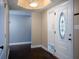 Bright entryway with dark hardwood floors and an elegant door at 2148 Chippewa Trl, Maitland, FL 32751