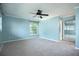 Light blue bedroom with carpeted floors and mirrored closet at 2148 Chippewa Trl, Maitland, FL 32751