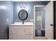 Bathroom with vanity, oval mirror, and access to another room at 2148 Chippewa Trl, Maitland, FL 32751